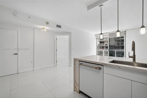 a kitchen with cabinets and window
