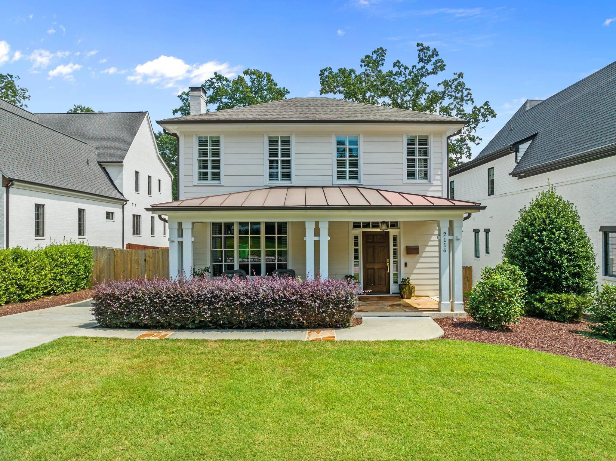 2116 Cowper Drive Raleigh, NC 27608 - Photo 12 of 65 The expansive covered porch has lighting and craftsman tongue and groove wood accents. Exterior Front