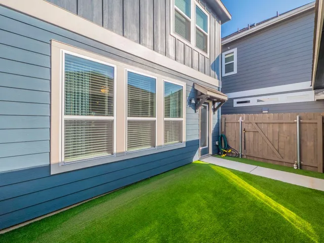 a picture of a bench in front of a wall