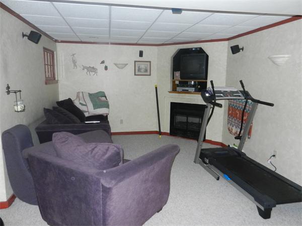 82 Crocker Nye Road Oakham, MA 01068 - Photo 7 of 7 a living room with furniture and a flat screen tv