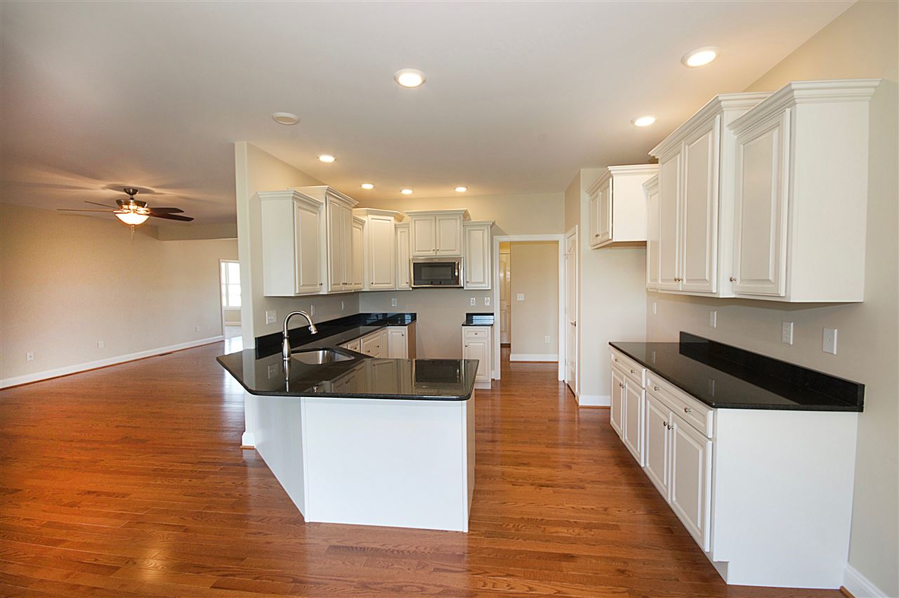 79 Benz Road Waynesboro, VA 22980 - Photo 8 of 19 a large kitchen with stainless steel appliances kitchen island granite countertop a large counter top a stove and a wooden floors