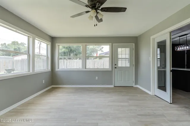 a view of an empty room with a window