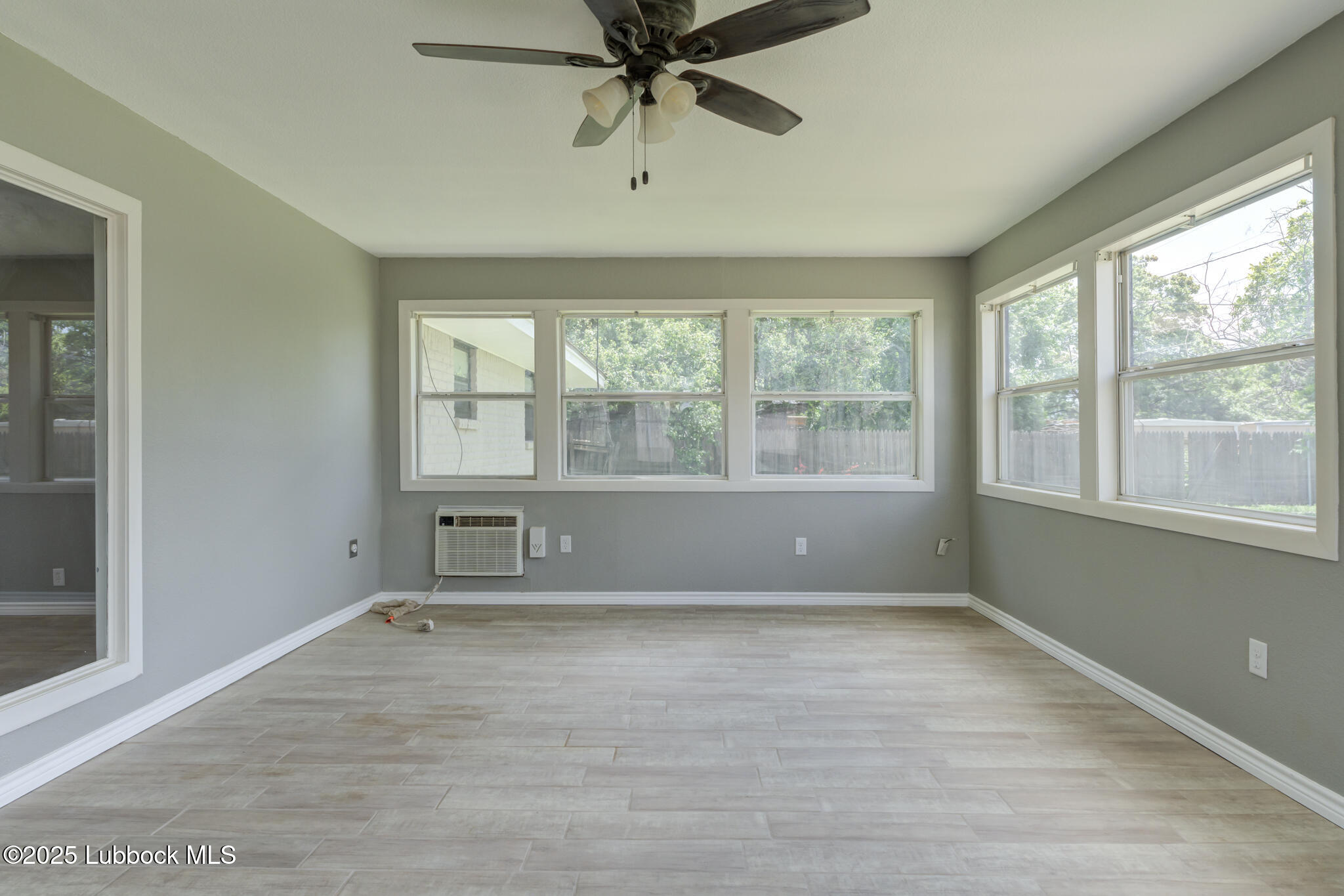 2803 West 18th Plainview, TX 79072 - Photo 29 of 32 wooden floor in an empty room with a window