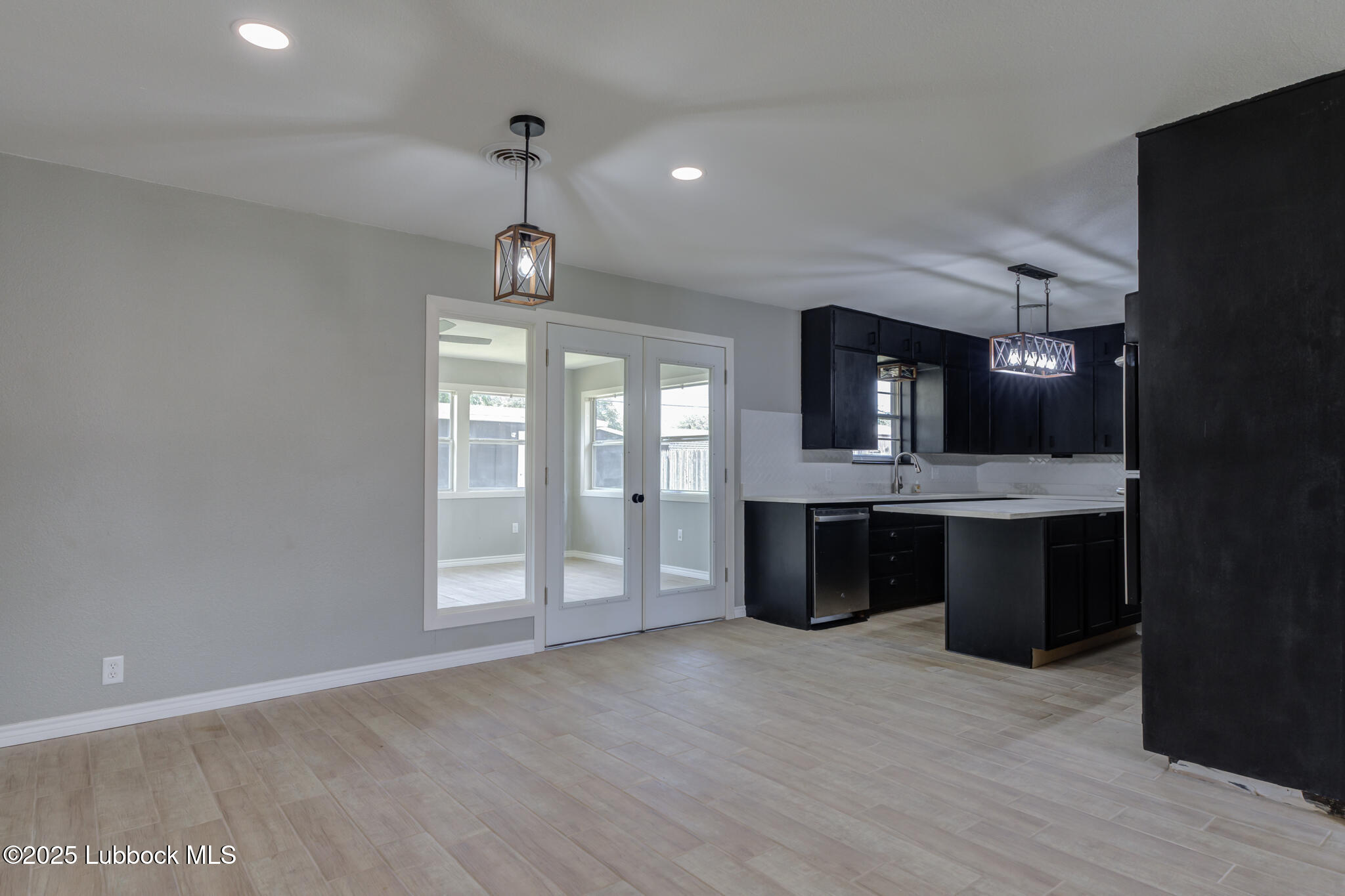 2803 West 18th Plainview, TX 79072 - Photo 9 of 32 a view of an empty room with a kitchen and a sink