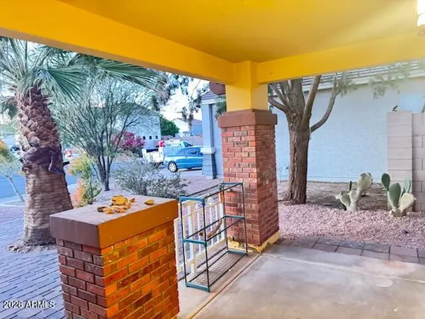 a kitchen with stainless steel appliances a refrigerator and a hard wood floor