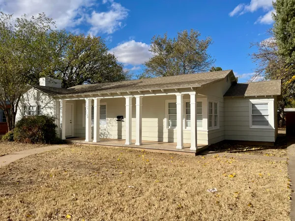 front view of a house with a small yard