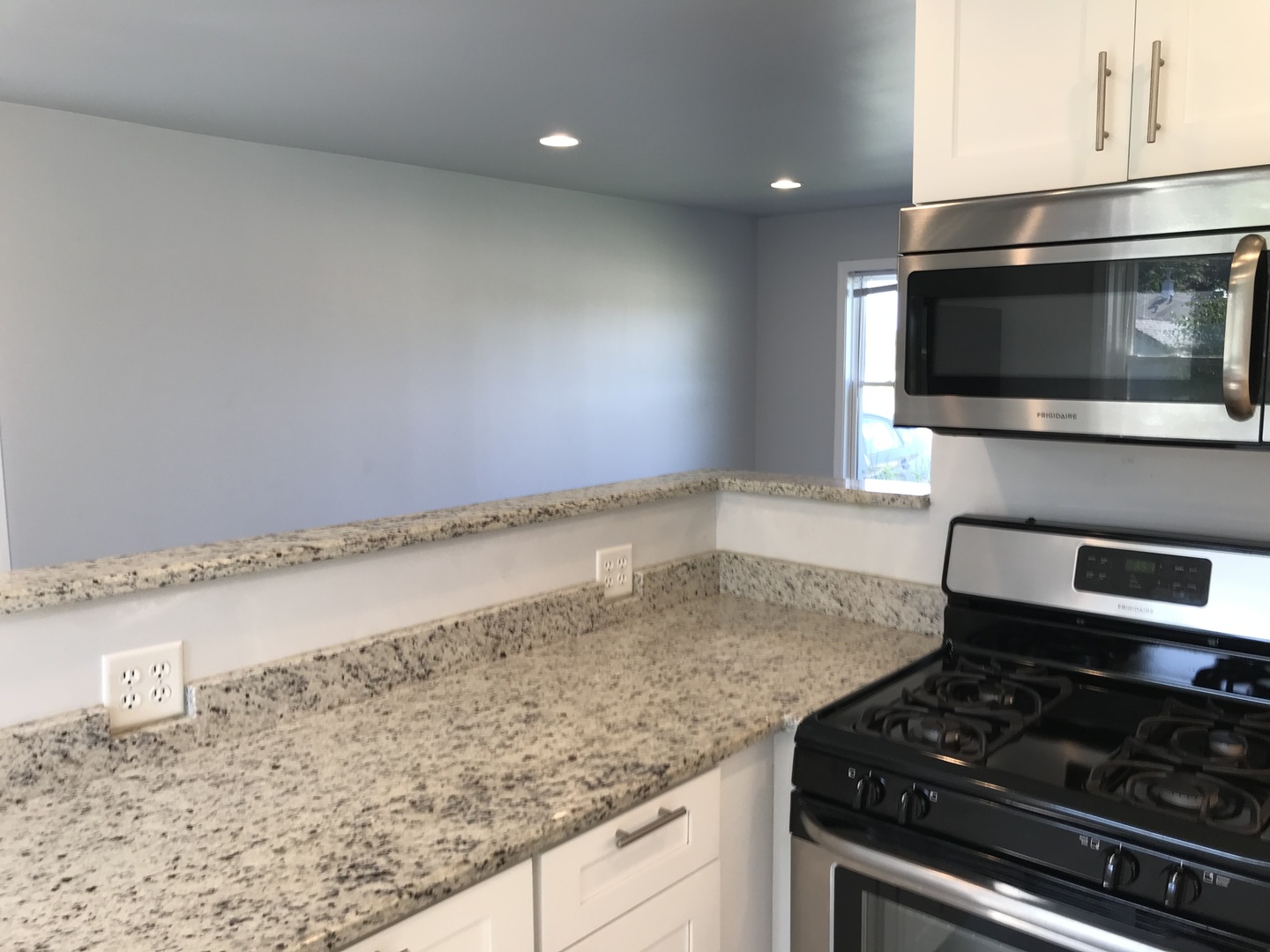 308 South Buffalo Grove Road Buffalo Grove, IL 60089 - Photo 3 of 13 a kitchen with a stove and a microwave