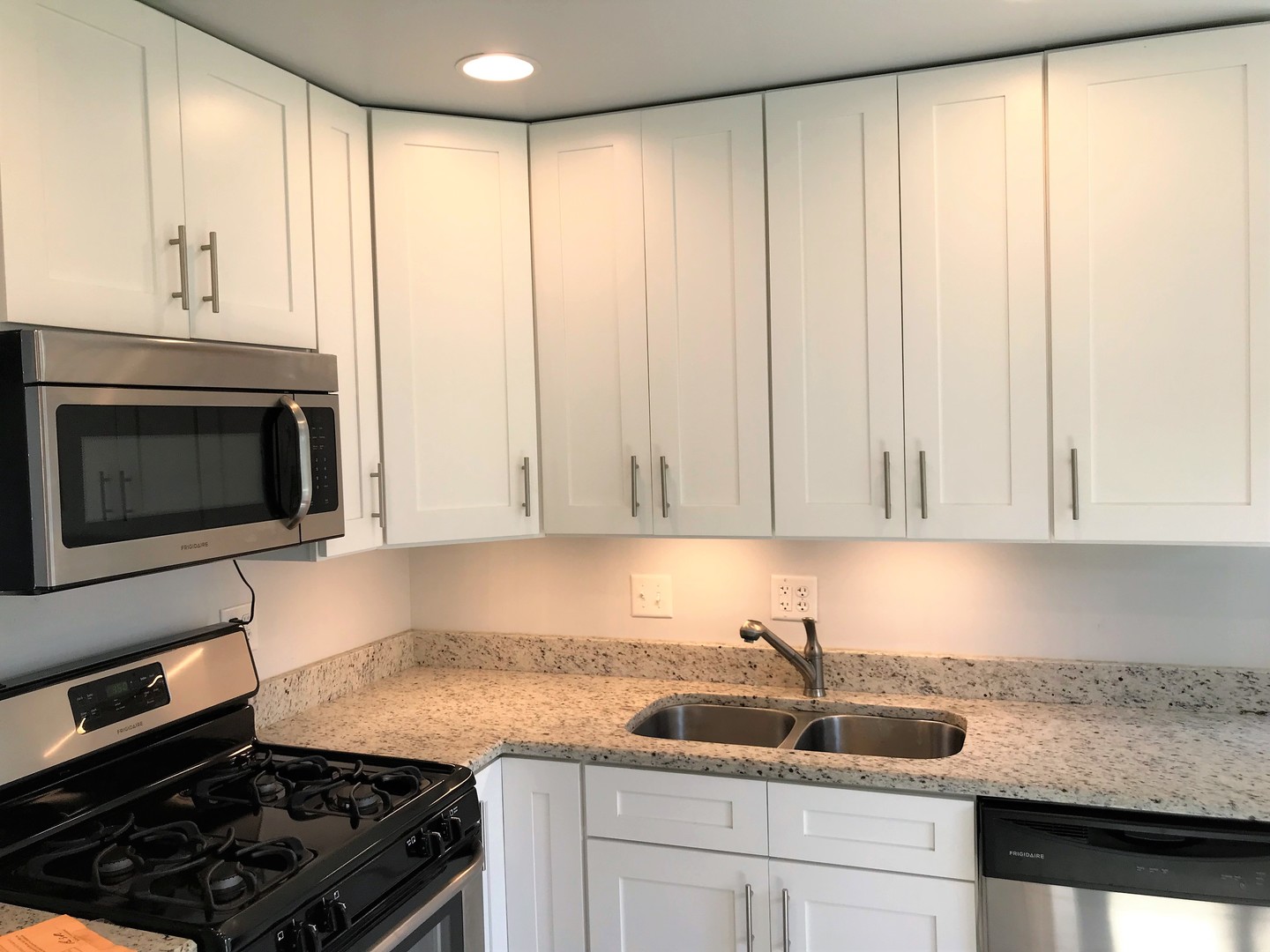 308 South Buffalo Grove Road Buffalo Grove, IL 60089 - Photo 4 of 13 a kitchen with granite countertop a sink stove and cabinets