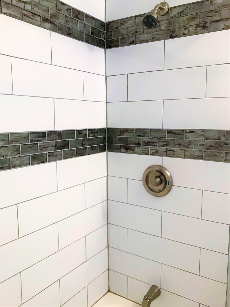 308 South Buffalo Grove Road Buffalo Grove, IL 60089 - Photo 7 of 13 a bathroom with a shower
