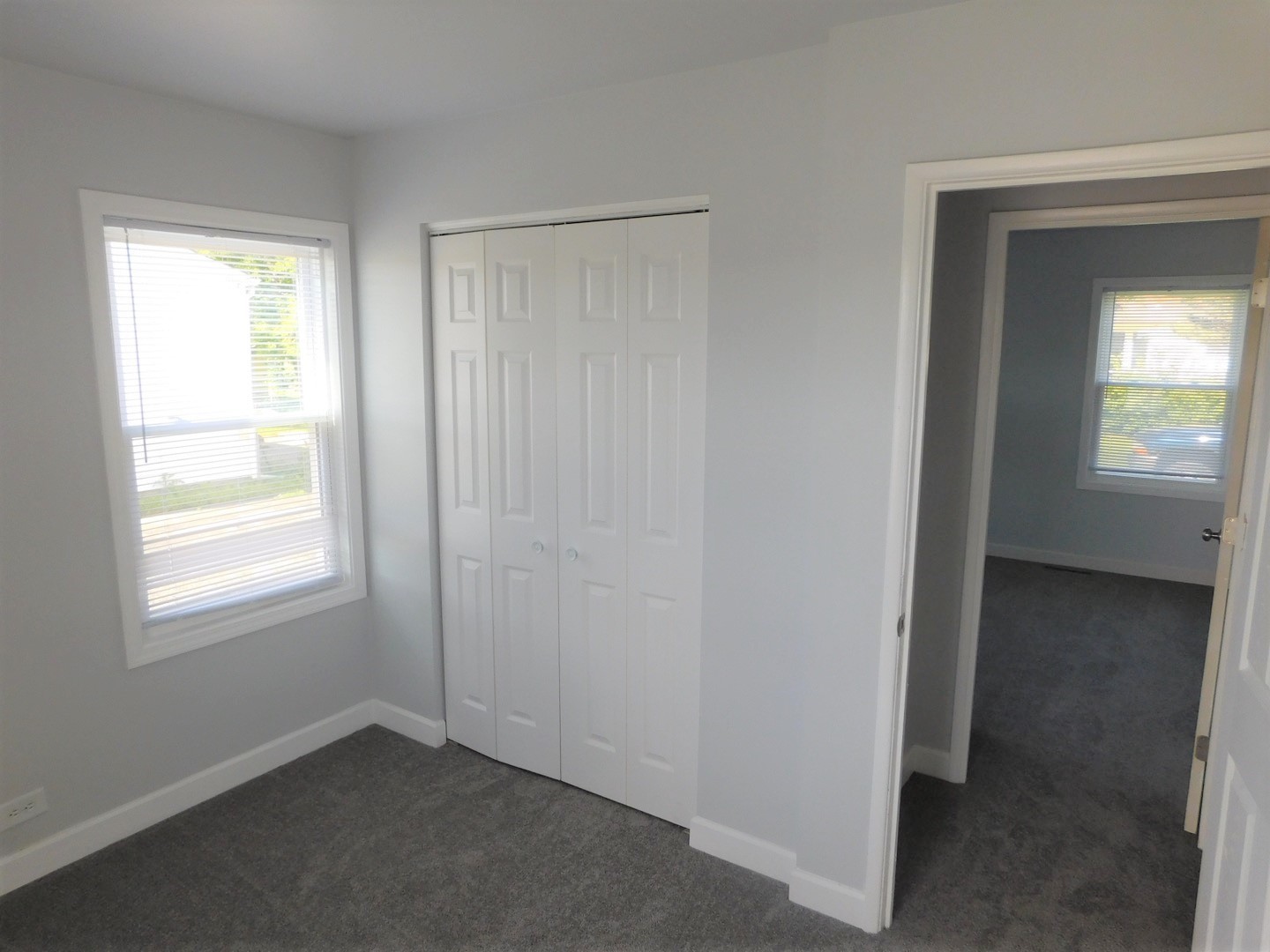 308 South Buffalo Grove Road Buffalo Grove, IL 60089 - Photo 9 of 13 an empty room with windows