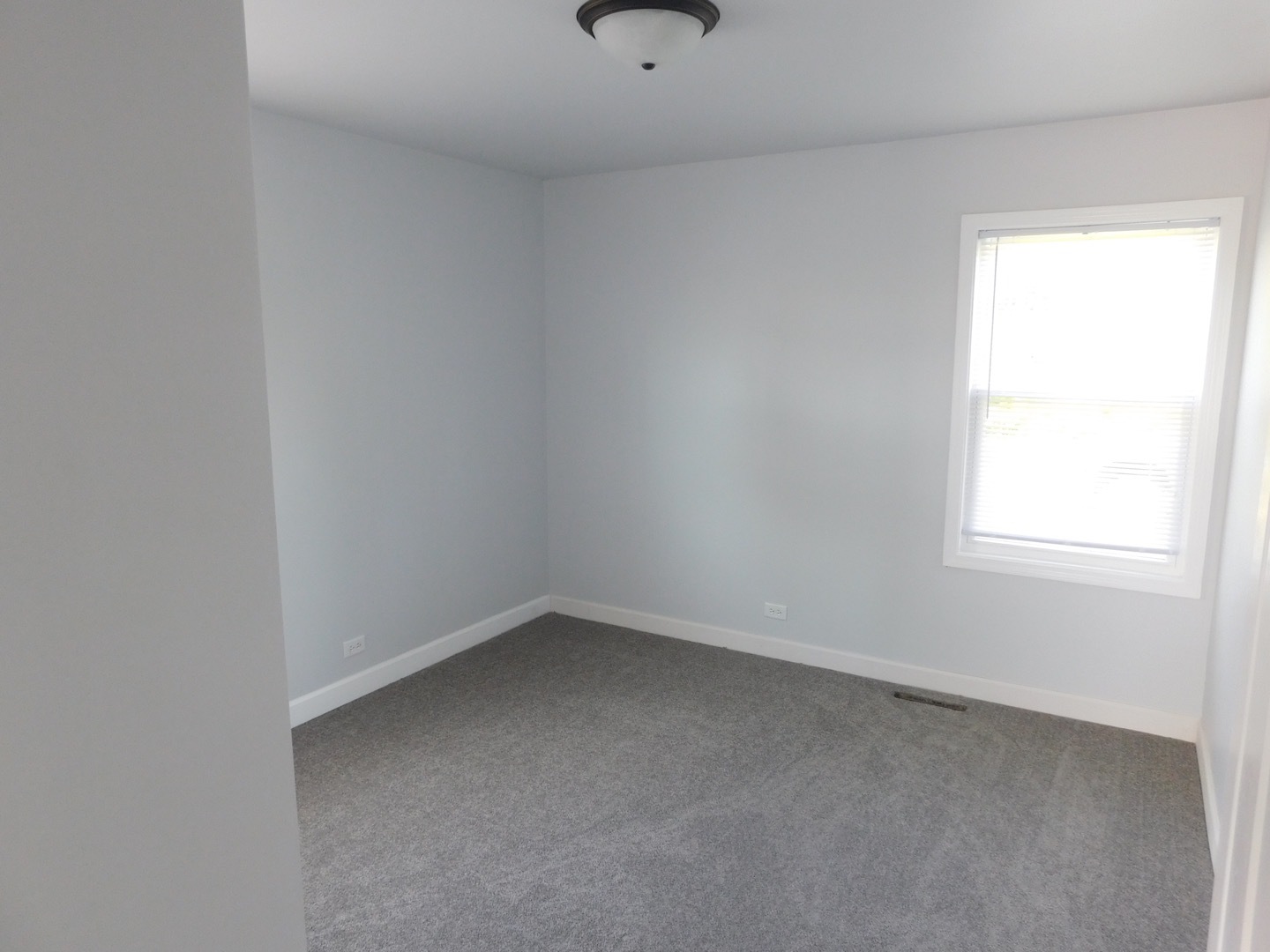 308 South Buffalo Grove Road Buffalo Grove, IL 60089 - Photo 10 of 13 a view of an empty room with a window