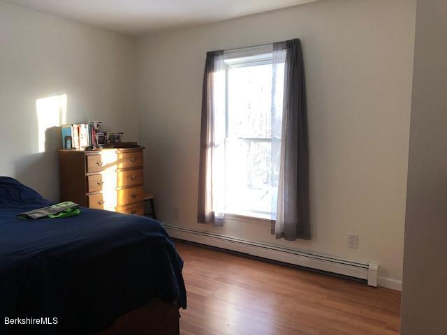 125 Middlefield Road Peru, MA 01235 - Photo 11 of 45 a bedroom with a bed and window