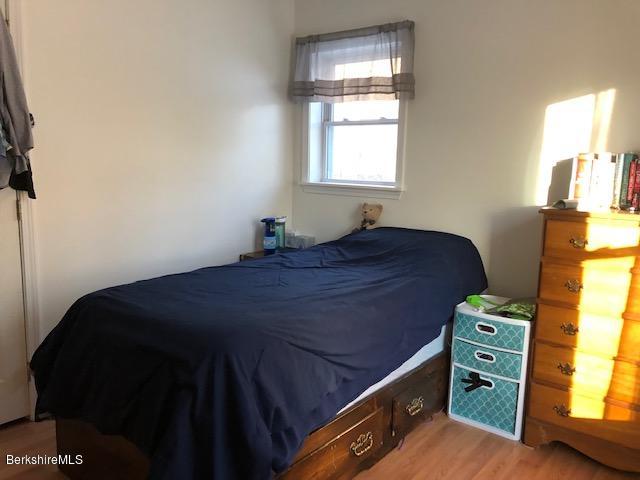 125 Middlefield Road Peru, MA 01235 - Photo 13 of 45 a bed sitting in a bedroom next to a window