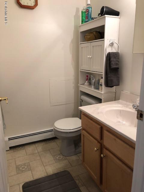 125 Middlefield Road Peru, MA 01235 - Photo 28 of 45 a bathroom with a sink a toilet and mirror