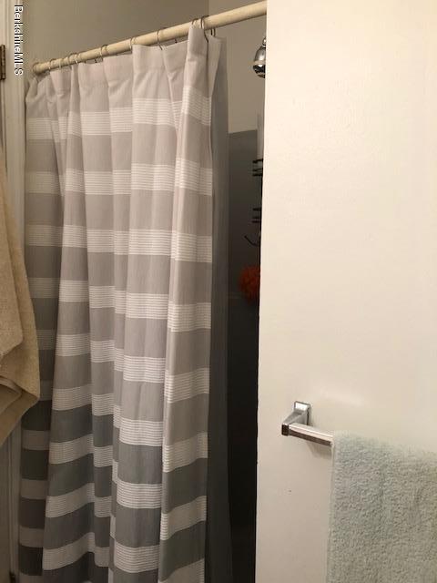 125 Middlefield Road Peru, MA 01235 - Photo 29 of 45 a bathroom with a shower curtain