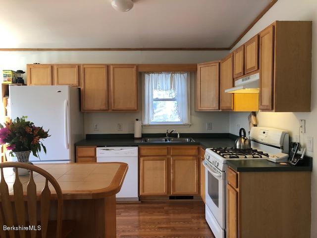 125 Middlefield Road Peru, MA 01235 - Photo 4 of 45 a kitchen with granite countertop a sink a counter top space and cabinets