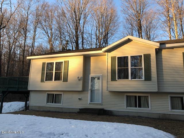 125 Middlefield Road Peru, MA 01235 - Photo 33 of 45 a front view of a house with a yard