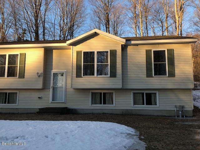 125 Middlefield Road Peru, MA 01235 - Photo 34 of 45 a front view of a house with yard