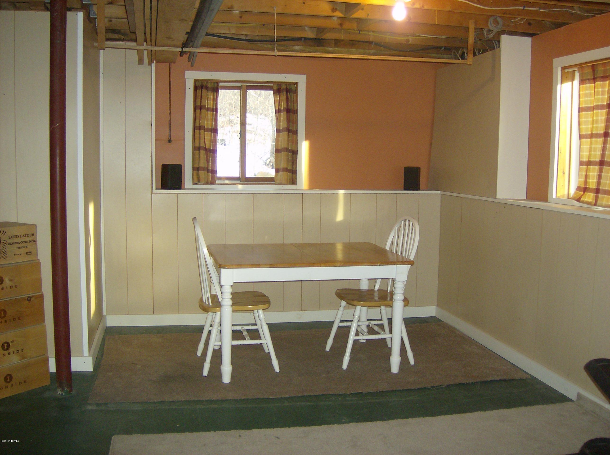 125 Middlefield Road Peru, MA 01235 - Photo 38 of 45 a view of a dining room with furniture wooden floor and front door