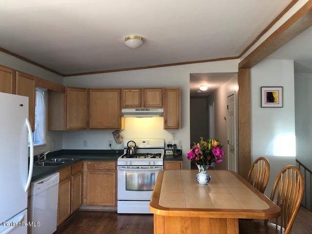 125 Middlefield Road Peru, MA 01235 - Photo 5 of 45 a kitchen with granite countertop kitchen island stainless steel appliances a sink stove and refrigerator