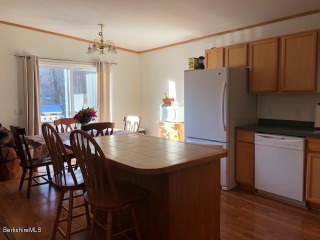 125 Middlefield Road Peru, MA 01235 - Photo 6 of 45 a dining room with furniture and wooden floor