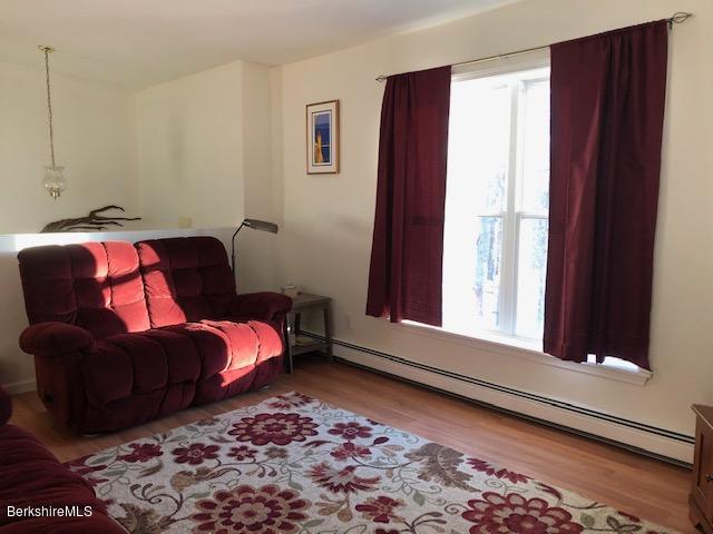 125 Middlefield Road Peru, MA 01235 - Photo 9 of 45 a living room with furniture and a window
