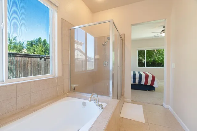 a bathroom with a bathtub and a shower