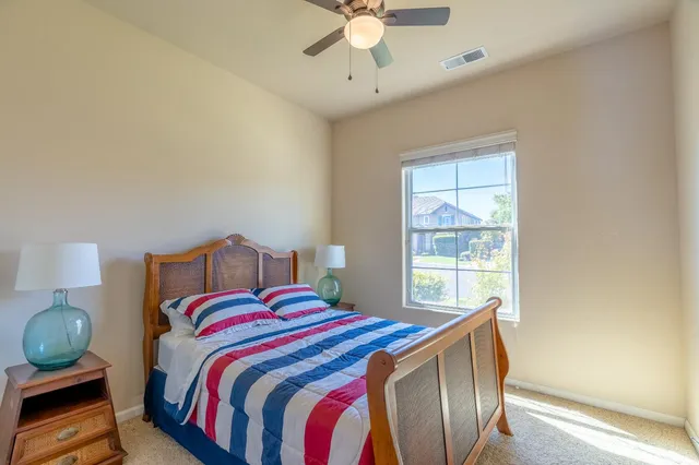 a bedroom with bed and window