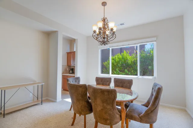 a view of a dining room with furniture window and outside view