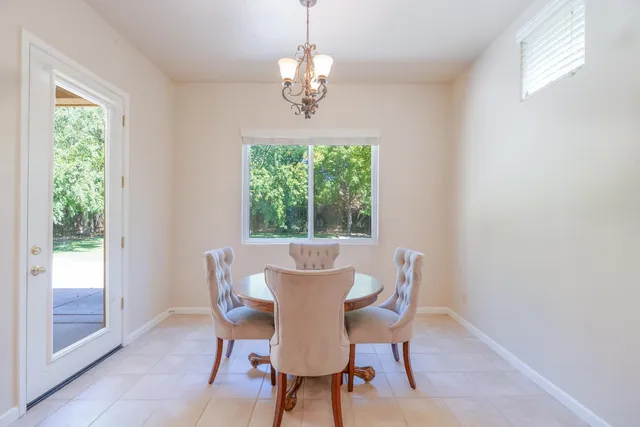 a view of a dining room with furniture window and outside view