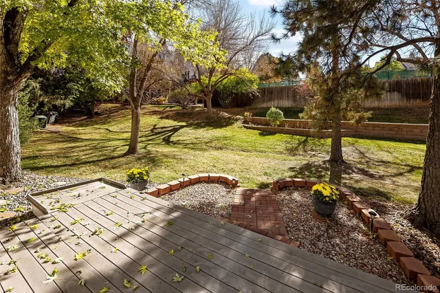 a view of a backyard with sitting area