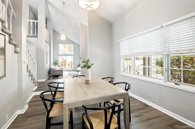 a view of a dining room with furniture window and wooden floor