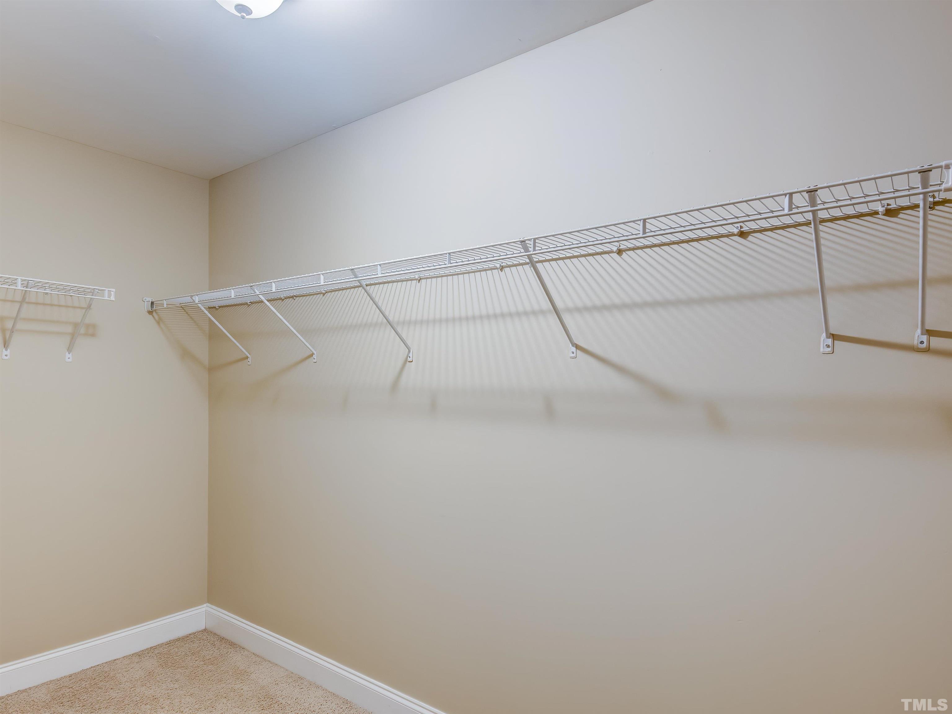1104 Kingston Ridge Road Cary, NC 27511 - Photo 21 of 26 a view of a room with racks on the wall