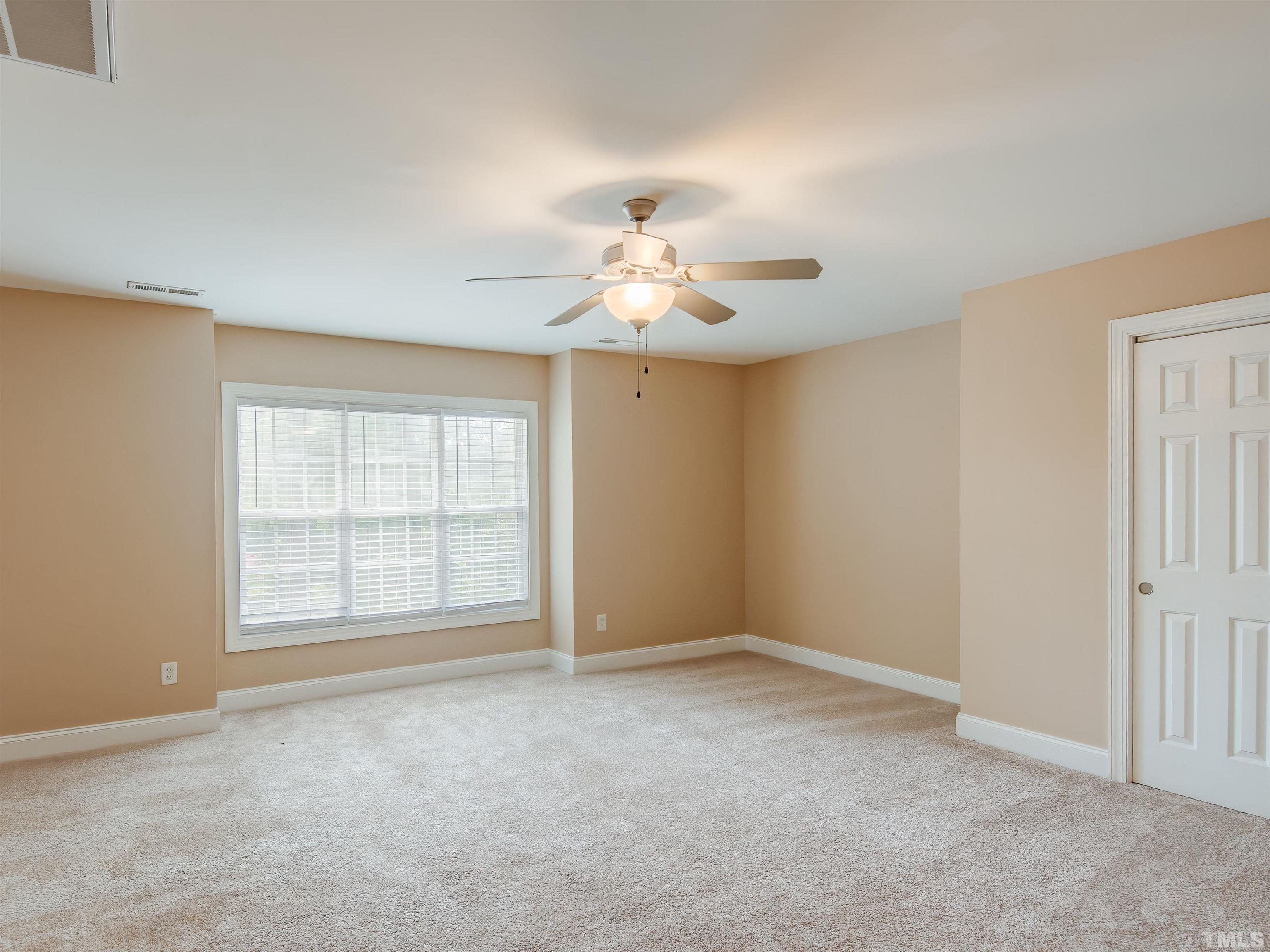 1104 Kingston Ridge Road Cary, NC 27511 - Photo 24 of 26 a view of an empty room with a window
