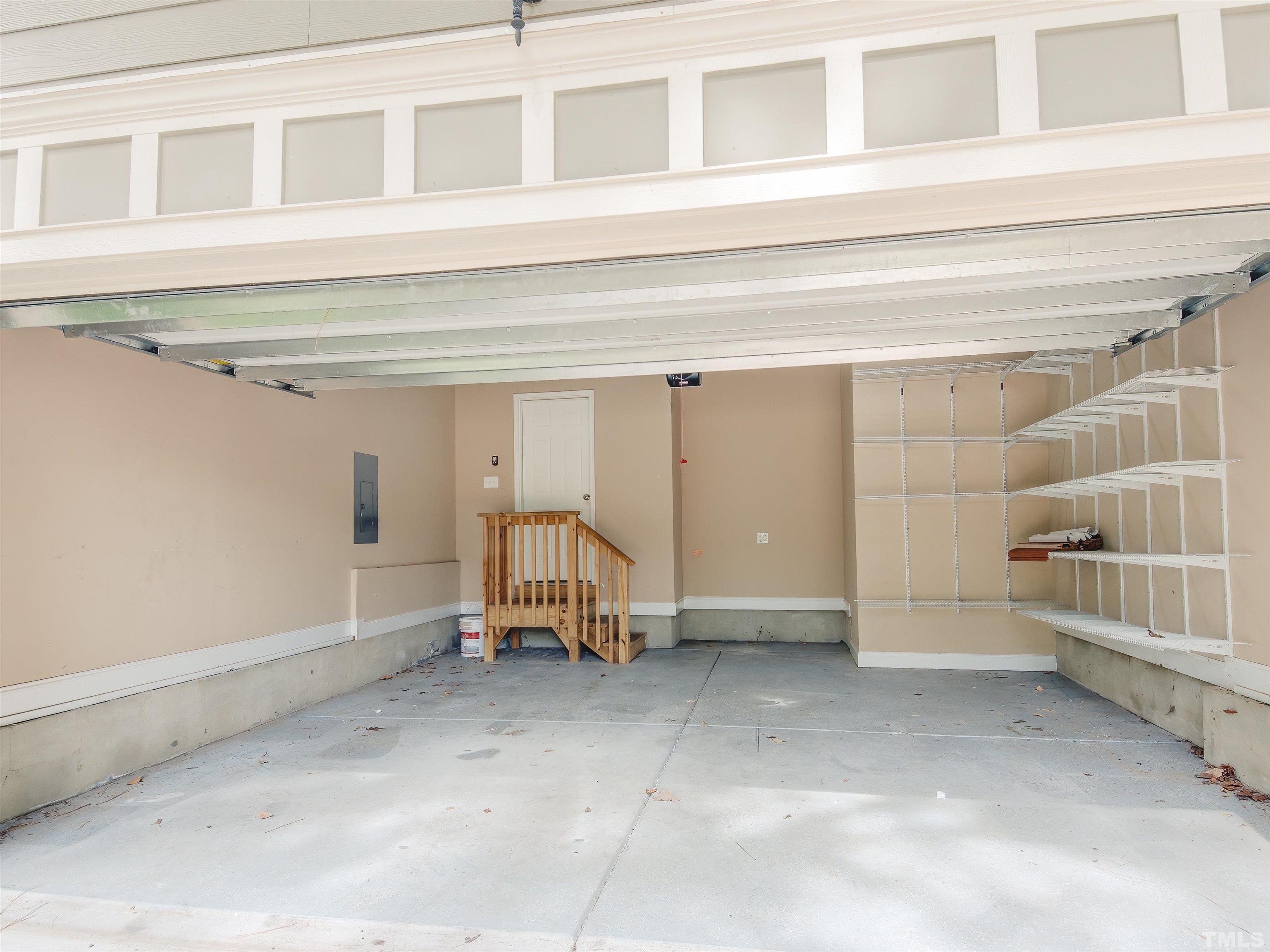 1104 Kingston Ridge Road Cary, NC 27511 - Photo 3 of 26 a view of empty room with a furniture and racks on the wall