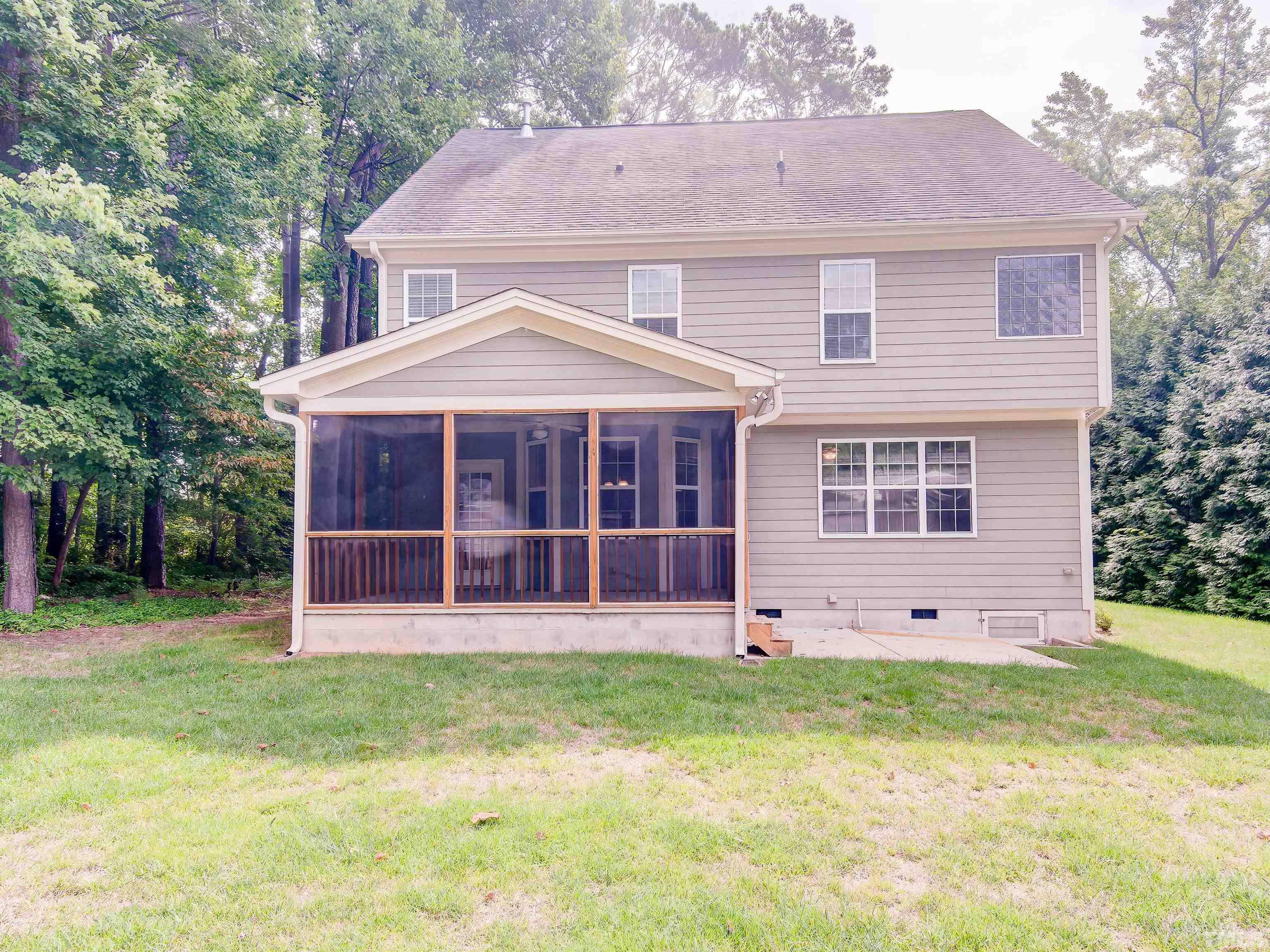 1104 Kingston Ridge Road Cary, NC 27511 - Photo 4 of 26 front view of a house with a yard