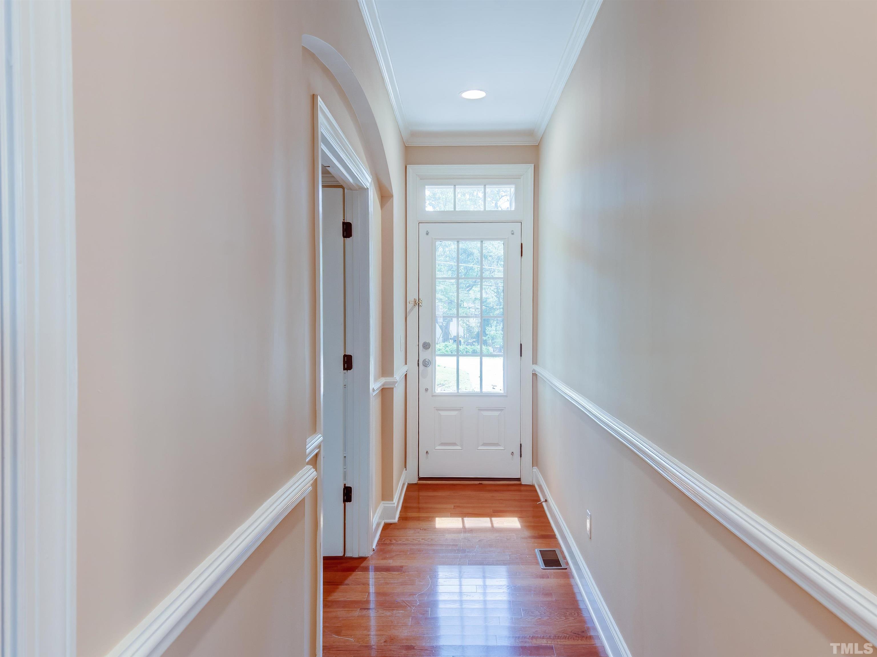 1104 Kingston Ridge Road Cary, NC 27511 - Photo 5 of 26 a view of hallway with wooden floor