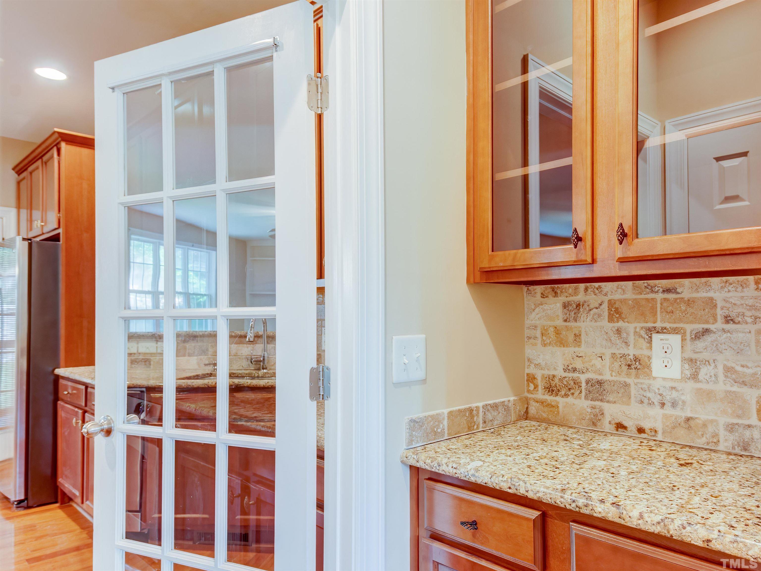 1104 Kingston Ridge Road Cary, NC 27511 - Photo 7 of 26 a view of a granite countertop cabinets