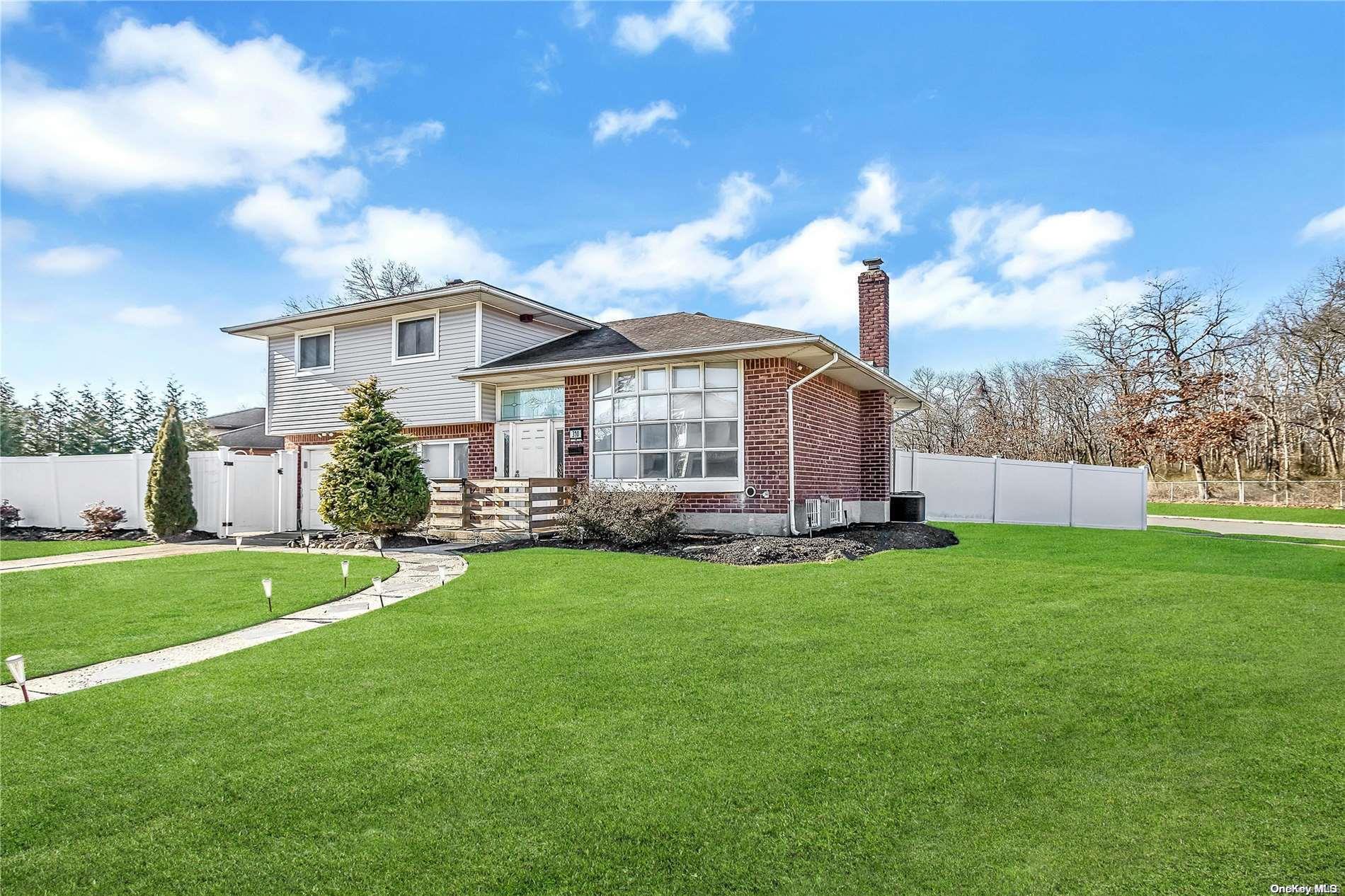 310 Coleridge Road Jericho, NY 11753 - Photo 1 of 1 a view of a house with backyard and a garden