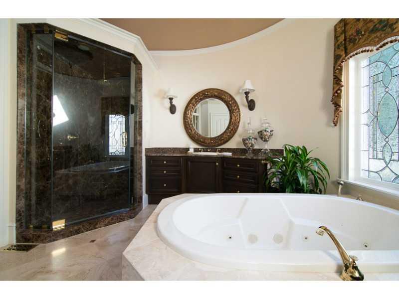 40 Dover Cliff Way Alpharetta, GA 30022 - Photo 12 of 24 a bathroom with a tub sink and mirror