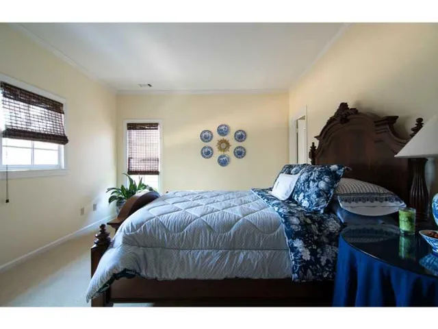 a bedroom with a bed and dresser