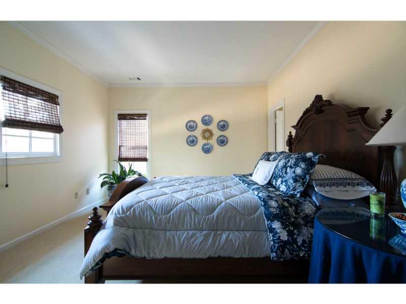 40 Dover Cliff Way Alpharetta, GA 30022 - Photo 16 of 24 a bedroom with a bed and dresser