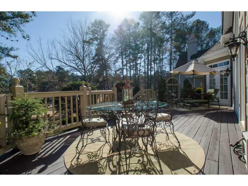 40 Dover Cliff Way Alpharetta, GA 30022 - Photo 19 of 24 a view of a patio with table and chairs potted plants with wooden floor