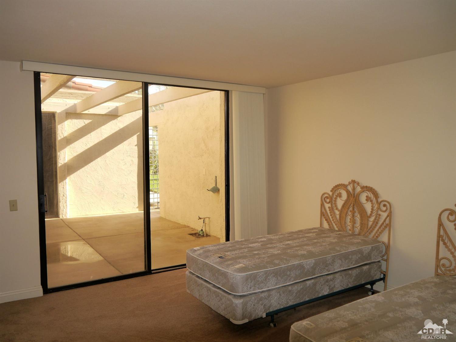 46330 Dove Road Indian Wells, CA 92210 - Photo 14 of 25 a bedroom with bed and window