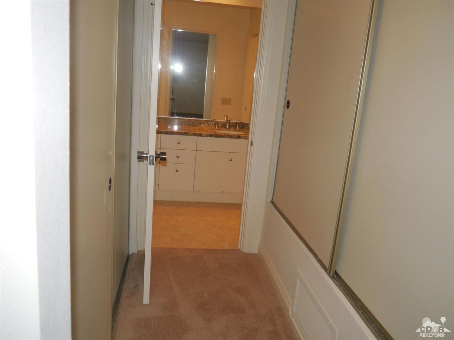 46330 Dove Road Indian Wells, CA 92210 - Photo 20 of 25 a view of a hallway with wooden floor