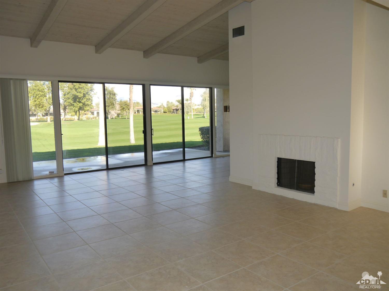 46330 Dove Road Indian Wells, CA 92210 - Photo 5 of 25 a view of an empty room with glass door