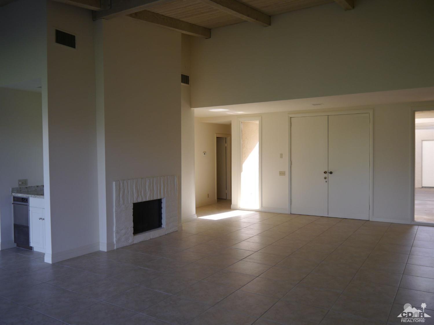 46330 Dove Road Indian Wells, CA 92210 - Photo 6 of 25 a view of an empty room with a fireplace