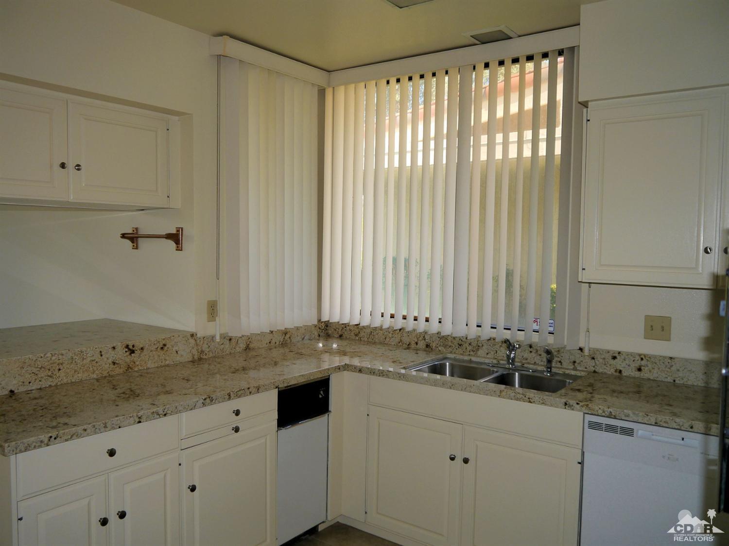 46330 Dove Road Indian Wells, CA 92210 - Photo 10 of 25 a bathroom with a granite countertop sink and a mirror