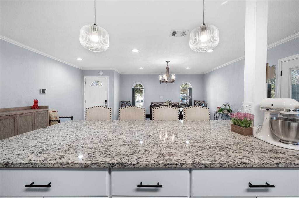2038 Rose Hill Road Carrollton, TX 75007 - Photo 13 of 35 a view of a kitchen and living room