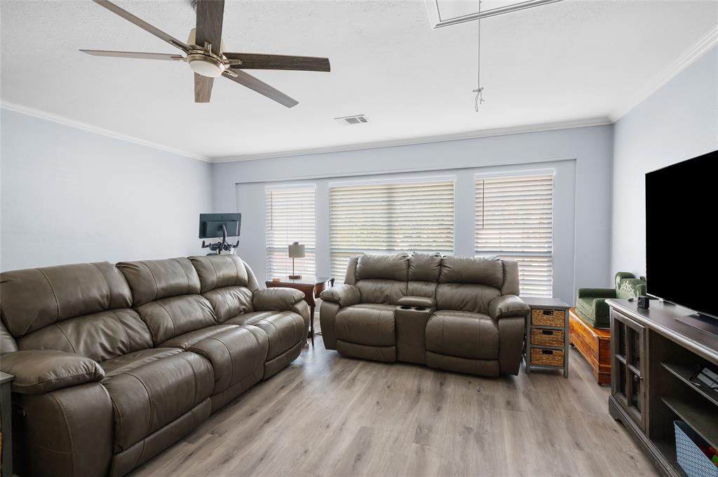 2038 Rose Hill Road Carrollton, TX 75007 - Photo 14 of 35 a living room with furniture and a flat screen tv